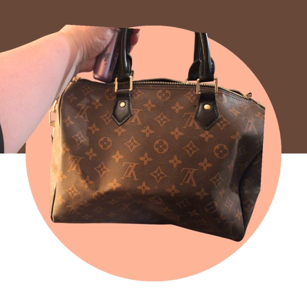 Louis Vuitton speedy 30 I Believe . Its Brown Black Version In Great Condition .